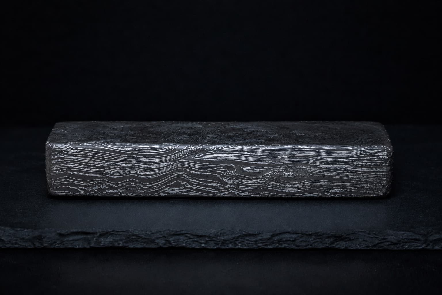 Folded damascus steel showing dense layered strata